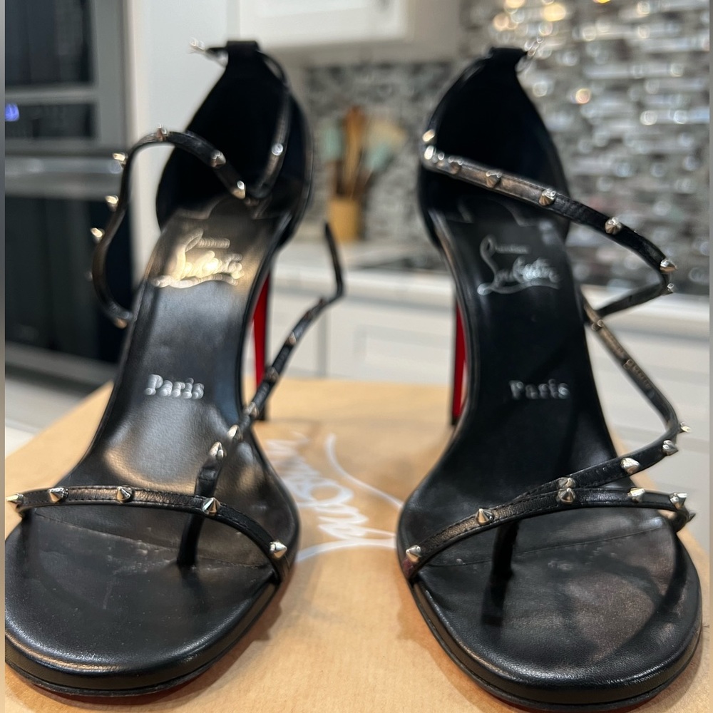 CHRISTIAN LOUBOUTIN
Black & Red Riojana Spikes 100mm Heeled Sandals